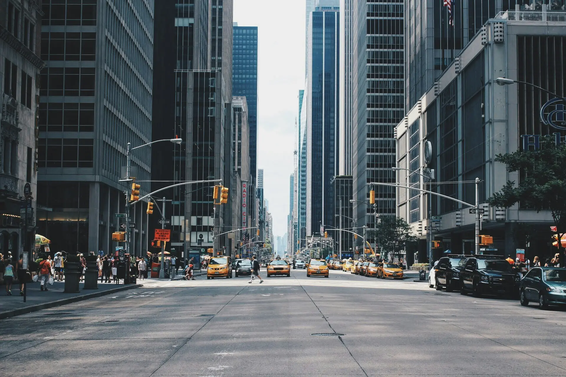 Office towers rising over a Manhattan street.